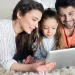 Why Do I Need Pest Control - happy family on floor of home looking at tablet